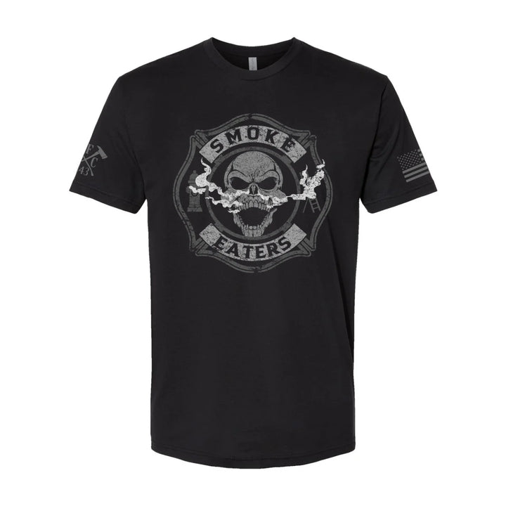 Front view of firefighter T-Shirt in black color featuring a full-front design print of a skull inhaling smoke, with a distressed grey and off-white look.