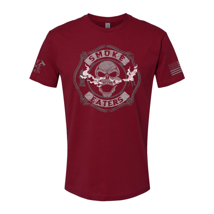 Front view of firefighter T-Shirt in cardinal red color featuring a full-front design print of a skull inhaling smoke, with a distressed grey and off-white look.