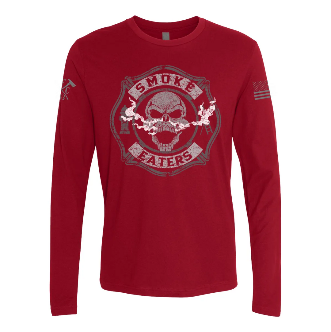 Front view of firefighter long sleeves in cardinal red color featuring a full-front design print of a skull inhaling smoke, with a distressed grey and off-white look.