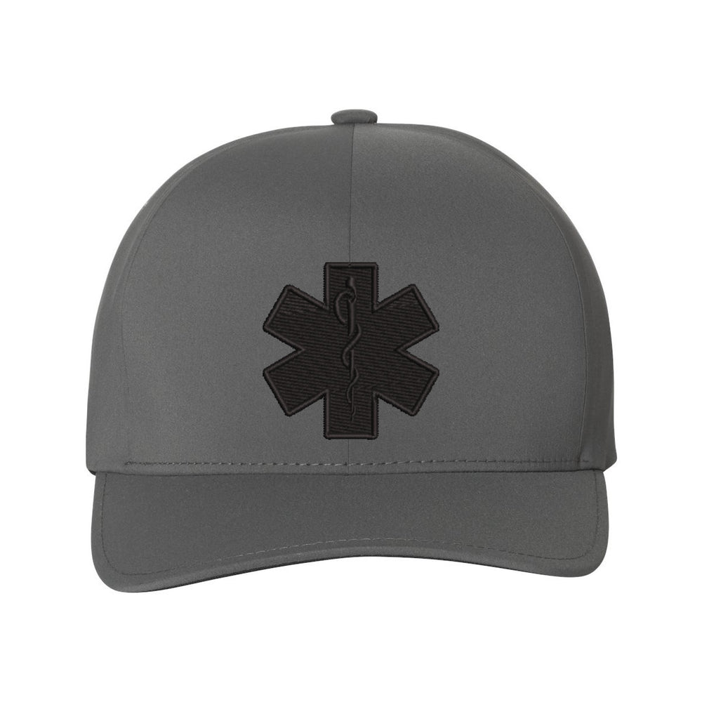 Close-up view of the black Star of Life emblem on the front panel of the Delta FlexFit hat.
