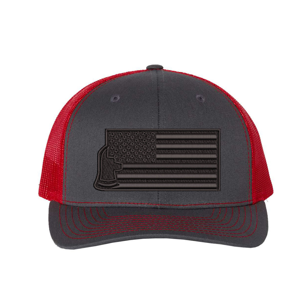 Detailed close-up of the crown of the Thin Red Line Axe Maltese Blackout Delta FlexFit Hat, focusing on its smooth design and the logo