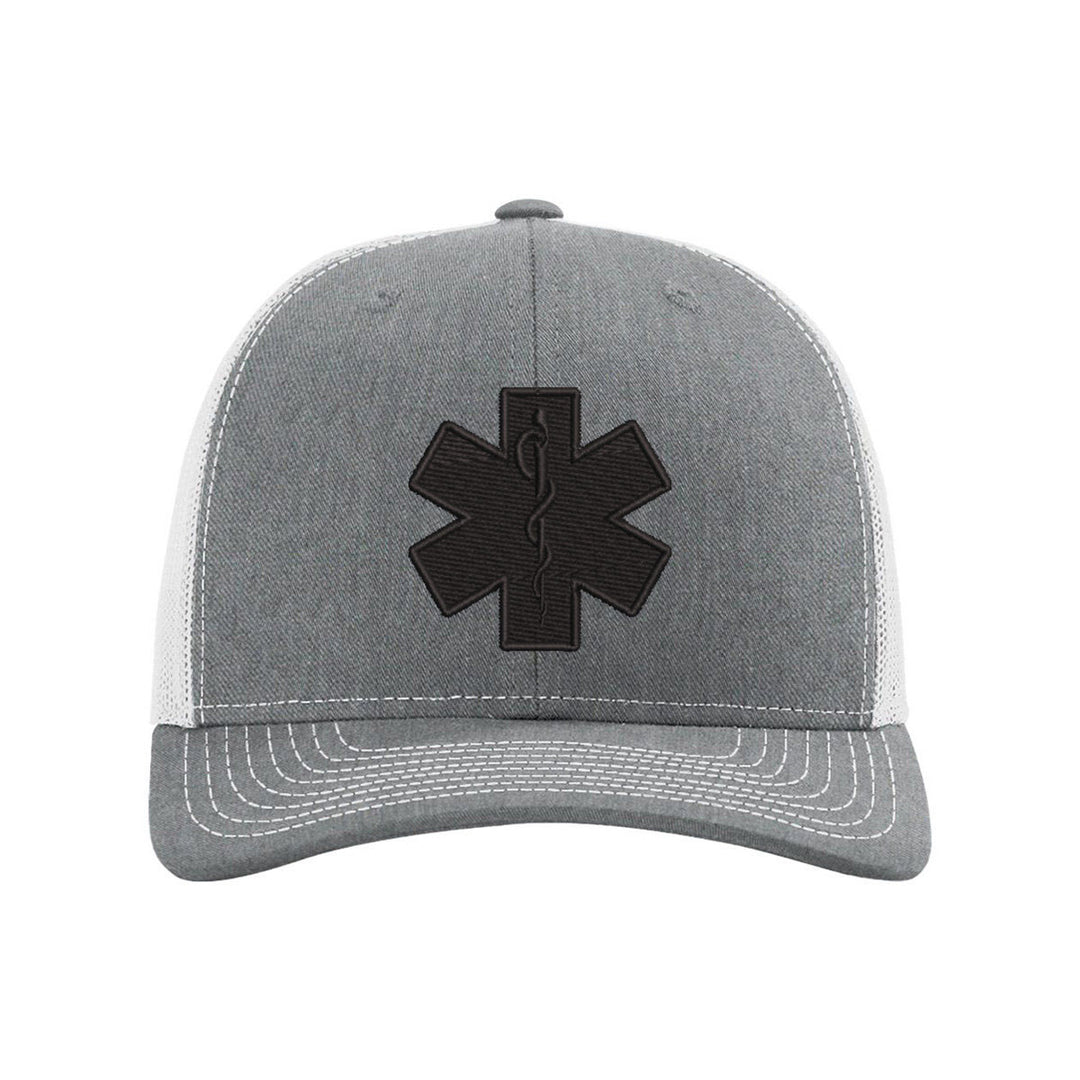 Black Star of Life emblem embroidery on a sleek blackout snapback trucker hat.