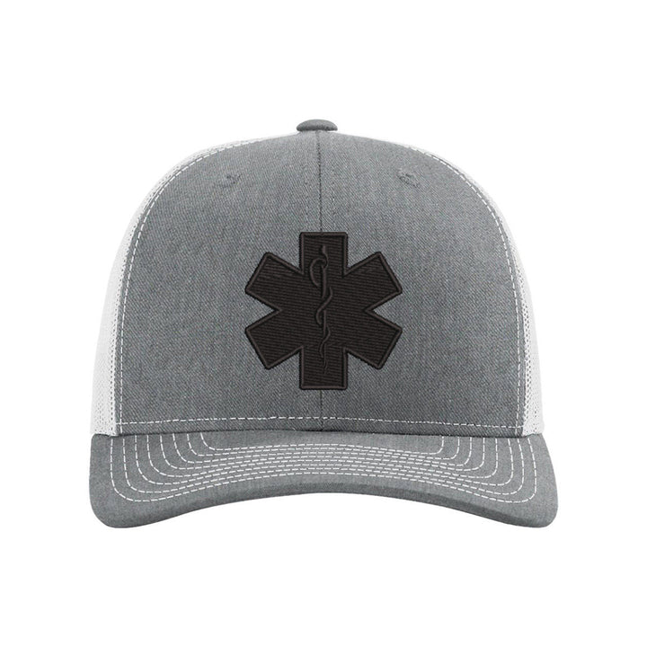 Black Star of Life emblem embroidery on a sleek blackout snapback trucker hat.
