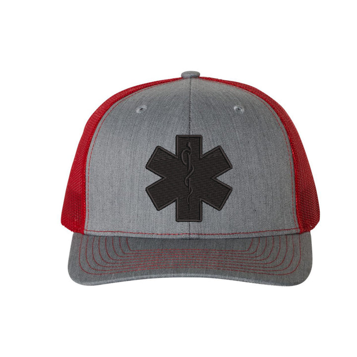 Blackout snapback trucker hat with black Star of Life emblem centered on the front.