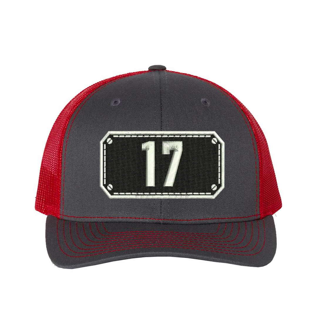 Richardson Trucker Hat.  Black Shield design with your fire station number embroidered in the shield.  Hat color charcoal/red.