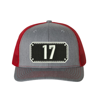 Richardson Trucker Hat.  Black Shield design with your fire station number embroidered in the shield.  Hat color heather grey/red.