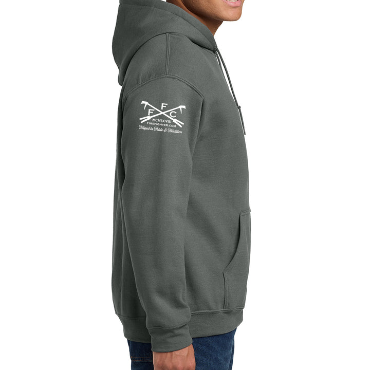 A side profile view of a person wearing a dark gray pullover hoodie with a white FFC logo on the upper left sleeve #color_charcoal