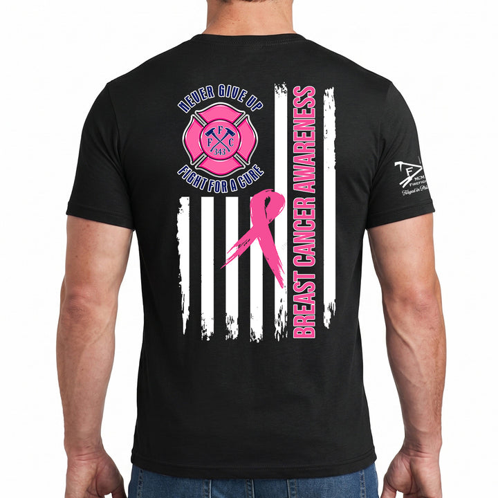 A man wearing a black short-sleeve t-shirt, viewed from the back. The shirt features a large graphic design with a pink fire department helmet and Maltese cross, a pink breast cancer ribbon, white vertical stripes, and text reading 'LIFELONG GIVE ME BREAST CANCER AWARENESS' and 'BREAST CANCER AWARENESS'. #color_black
