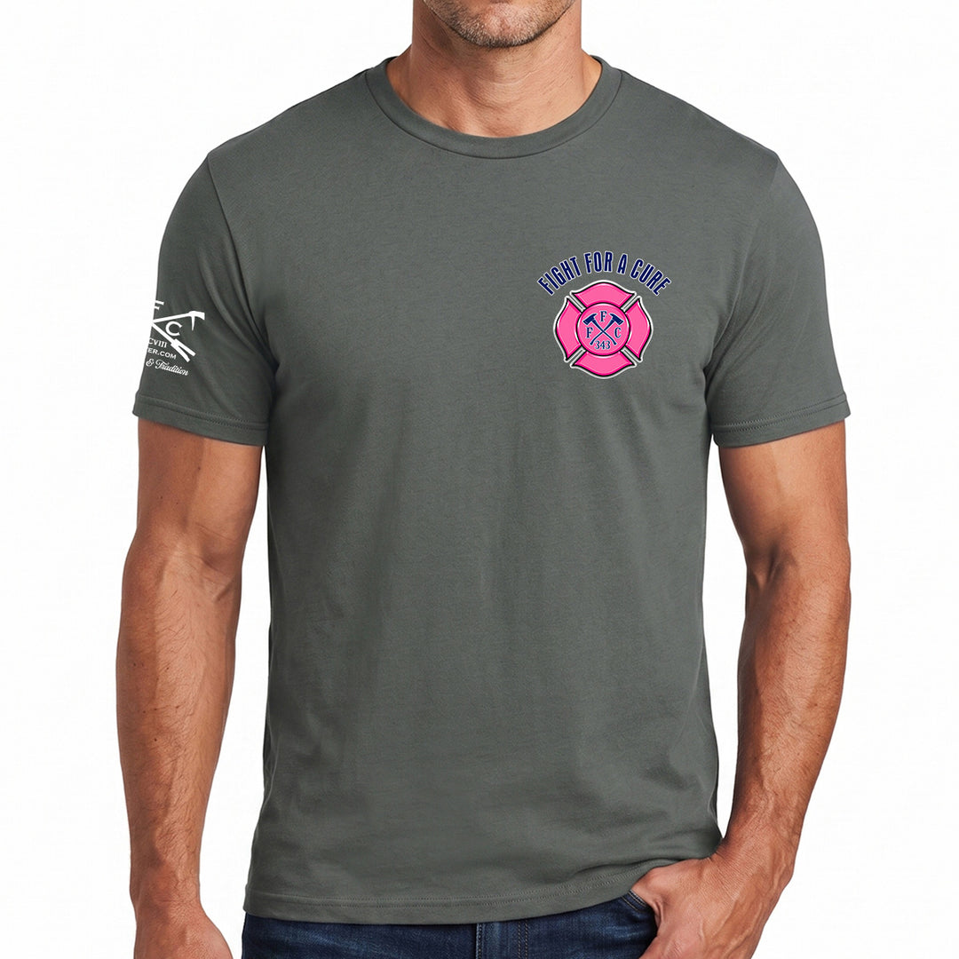 A man wearing a dark gray crewneck t-shirt with a pink and blue fire department graphic on the left chest and a white graphic on the right sleeve, shown against a plain white  background. #color_charcoal
