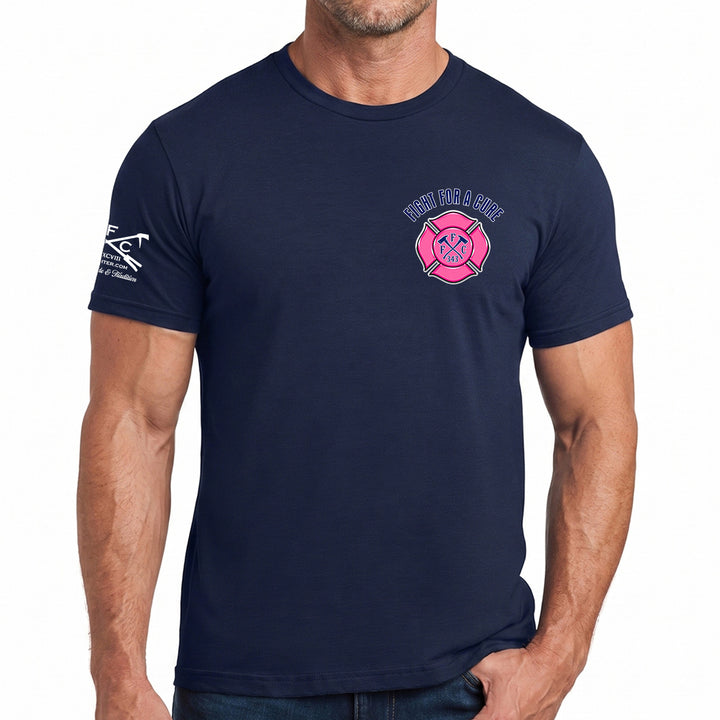A man wearing a navy blue short-sleeve t-shirt with a pink and white 'Firefighter & Rescue' graphic on the left chest and a white graphic on the right sleeve, breast cancer awareness t-shirt #color_navy