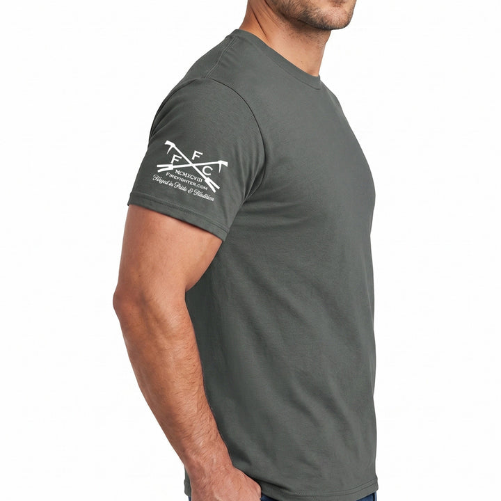 A man wearing a dark gray crewneck t-shirt, shown from a side profile against a plain white background. The shirt features a white official logo of FFC #color_charcoal
