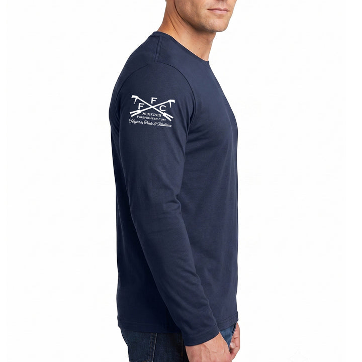 A man wearing a navy blue long-sleeve t-shirt with a white printed graphic on the left shoulder, logo of firefighter.com #color_navy