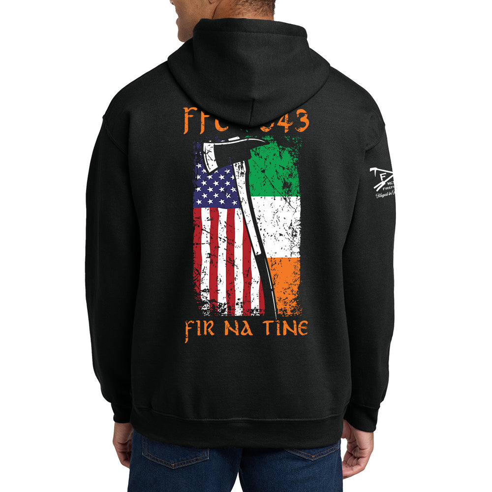 A man wearing a black hoodie, viewed from the back. The hoodie features a large graphic print on the back with the text 'FIR 043' and 'FIR NA TINE' #color_black