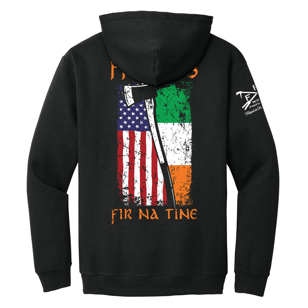 Black pullover hoodie shown from the back, featuring a large distressed graphic of the American flag and Irish flag with an axe overlay, plus orange text reading 'FIR NA TINE' and a white sleeve print. #color_black