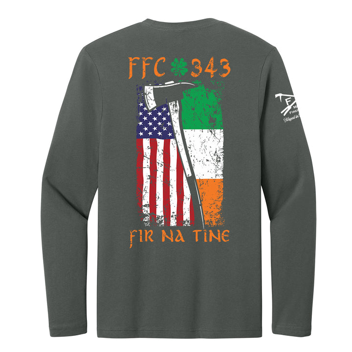 A dark gray long-sleeve t-shirt shown from the back, featuring a distressed graphic of the American flag and the Irish flag with an axe, along with the text 'FFC 343' and 'FIR NA TINE'. #color_charcoal