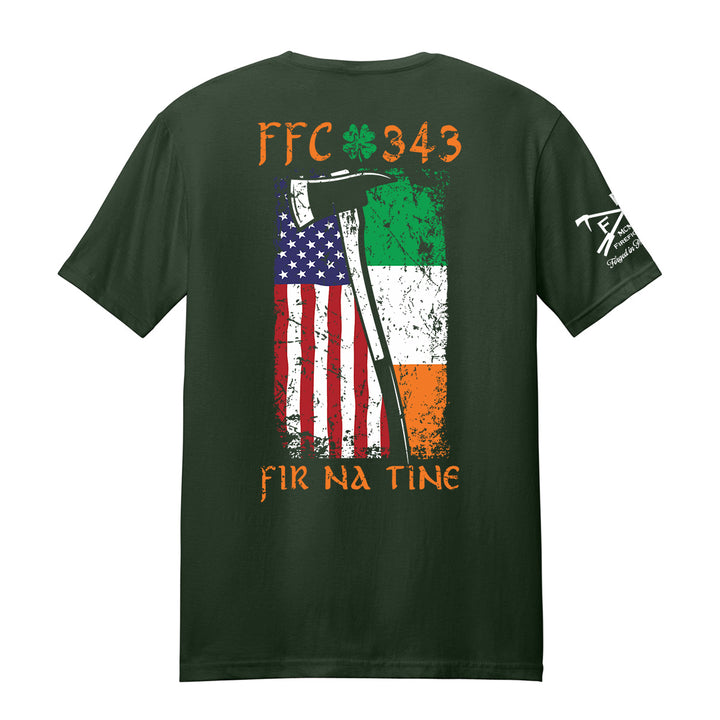 A dark forest green t-shirt shown from the back, featuring a distressed graphic of the American and Irish flags with a scythe, orange text reading 'FFC 343' and 'FIR NA TINE', and a white graphic on the left sleeve. #color_forest-green
