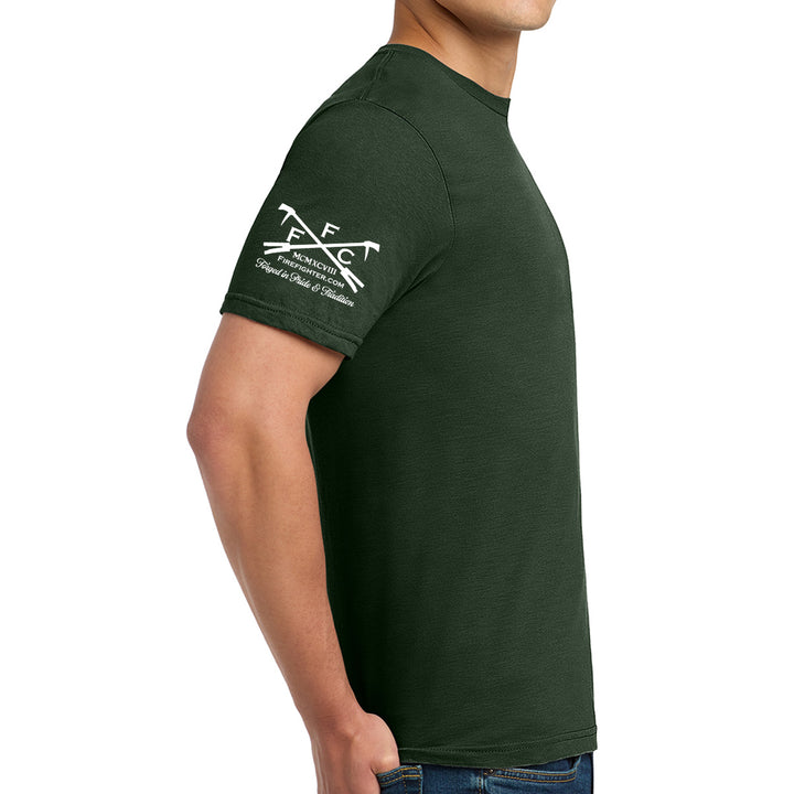 A man wearing a dark forest green short-sleeve t-shirt with a FFC logo printed logo on the right sleeve, shown from a side profile against a plain white background. #color_forest-green