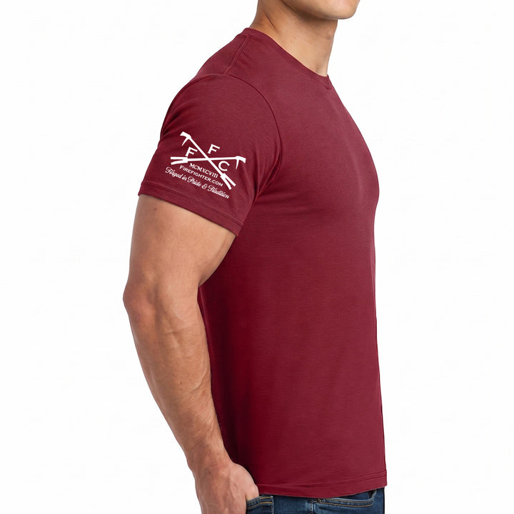 A man wearing a maroon short-sleeve crewneck t-shirt with a white printed firefigher.com official logo