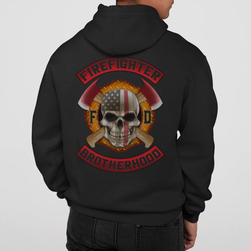 A man wearing a black firefighter hoodies shirt with a full back design of a skull design with an American flag and crossed axe