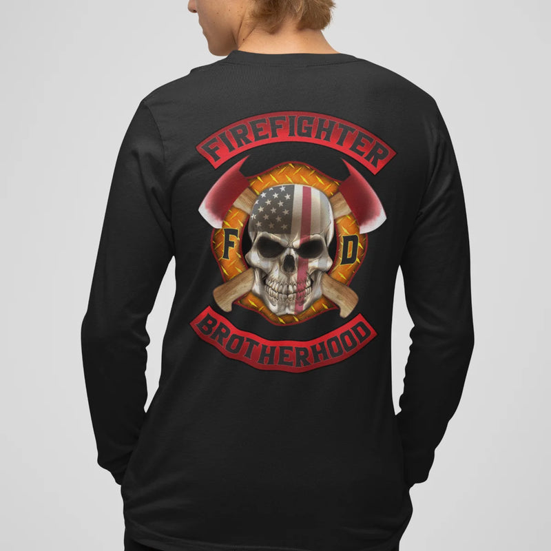 A man wearing a black firefighter long sleeve shirt with a full back design of a skull design with an American flag and crossed axe