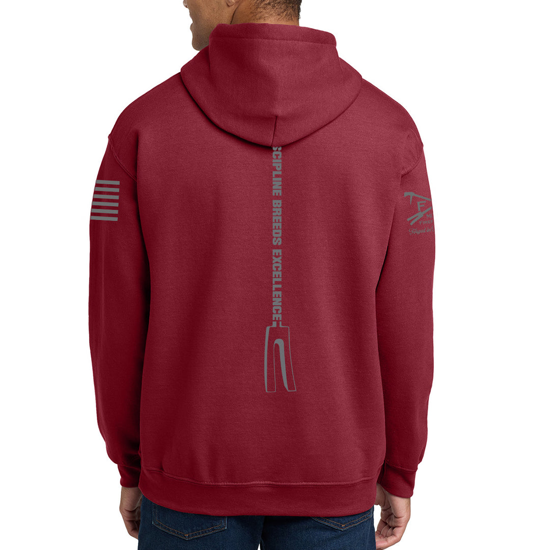 A man wearing a maroon hoodie from the back, featuring a vertical gray graphic #color_cardinal-red