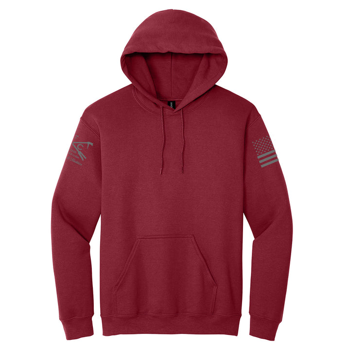 A maroon pullover hoodie with a drawstring hood, kangaroo pocket, and subtle gray graphic prints on both sleeves, shown against a plain white background. #color_cardinal-red