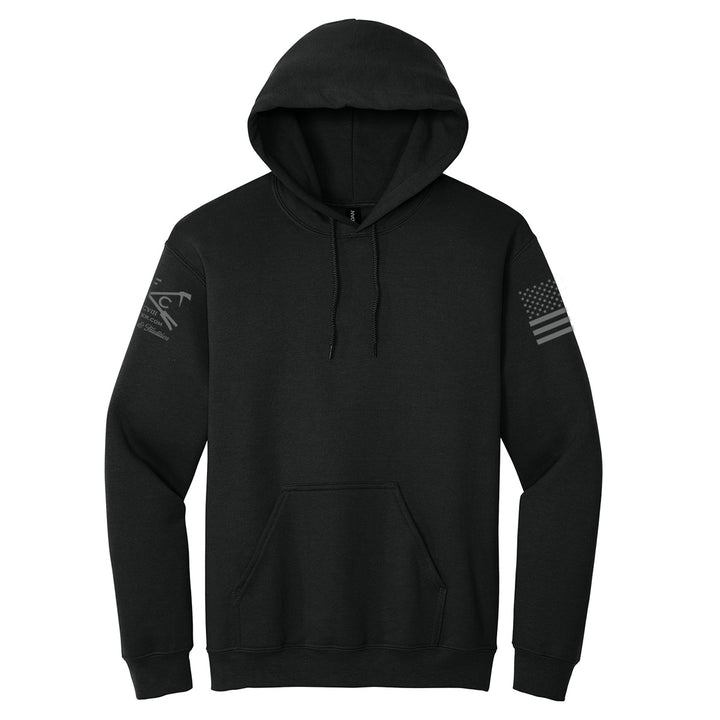 A black pullover hoodie with a drawstring hood and kangaroo pocket, featuring a dark gray distressed American flag graphic on the right sleeve and a dark gray eagle graphic on the left sleeve, shown against a plain white background. #color_black