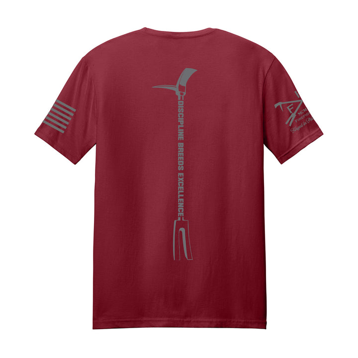 A maroon short-sleeve t-shirt shown from the back, featuring a gray vertical graphic of an ice axe with the text 'discipline BREEDERS EXCELLENCE' and gray sleeve prints. #color_cardinal-red