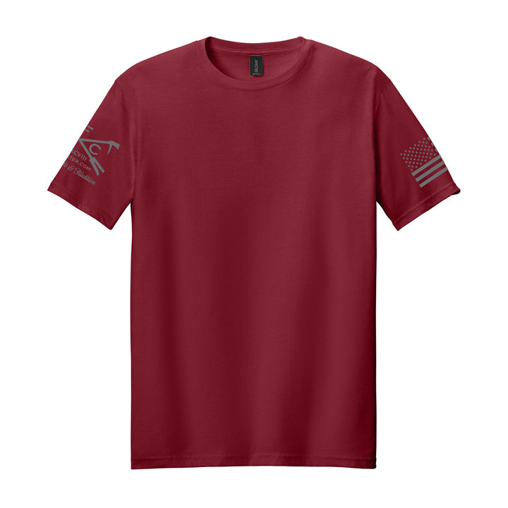 A short-sleeve crewneck t-shirt in maroon red, featuring a dark gray graphic on the right sleeve and a distressed American flag design on the left sleeve, displayed against a solid white background. #color_cardinal-red