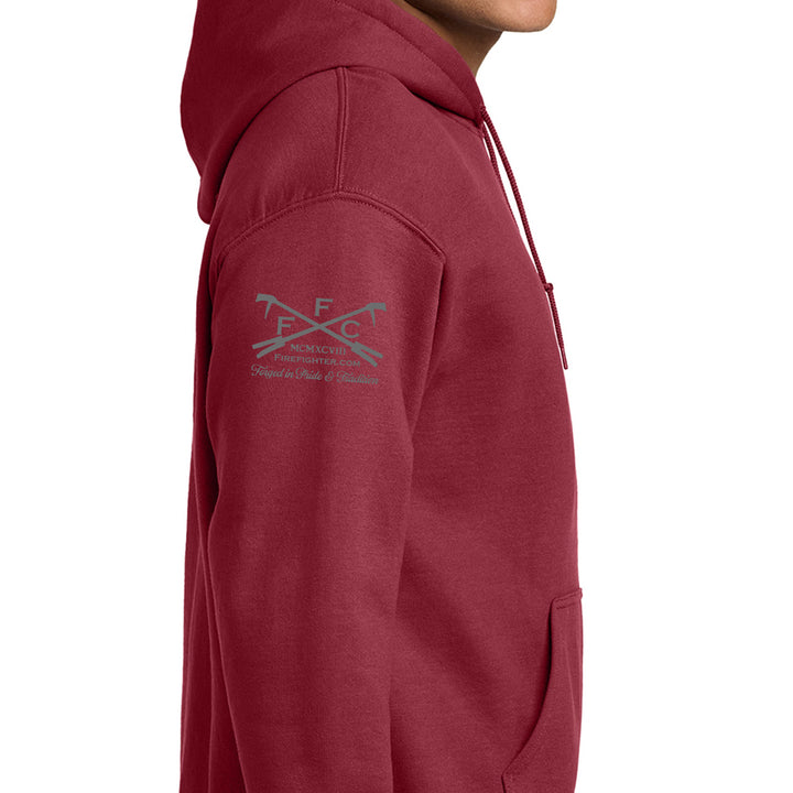 A close-up side view of a person wearing a heathered maroon pullover hoodie with a gray printed logo on the upper left sleeve, set against a plain white background. #color_cardinal-red