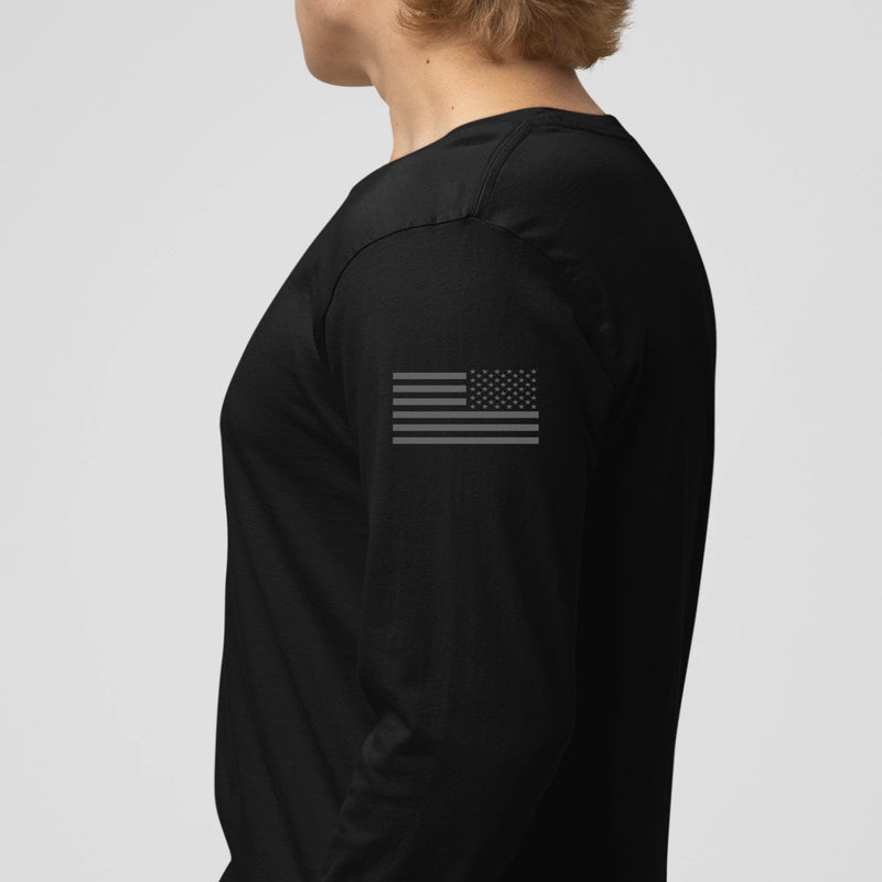 Left side view of a firefighter long sleeves in navy  with the USA  flag printed.