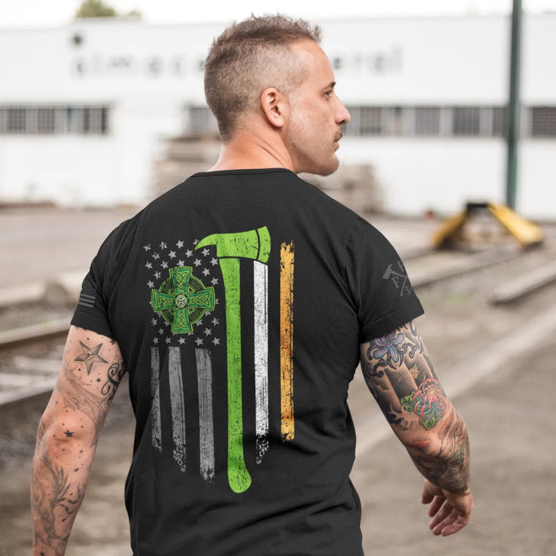 A man wearing showing the full back design of firefighter graphic t-shirt featuring a distressed USA flag accented by a green axe