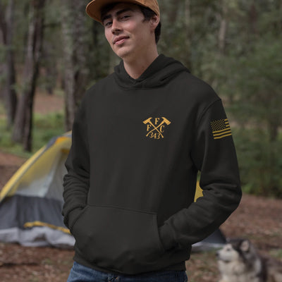 A man wearing a black firefighter hoodies shirt with a left chest print of FFC 343 logo