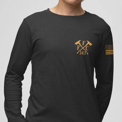 A man wearing a black firefighter long sleeve shirt with a left chest print of FFC 343 logo