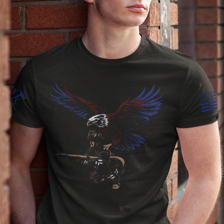 A man wearing showing the full front design of firefighter graphic t-shirt featuring a firefighter with an eagle as his guardian