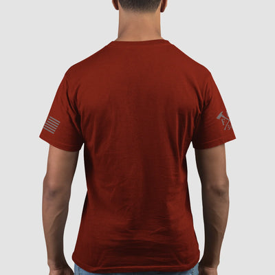 A man wearing a cardinal red firefighter graphic T-shirt