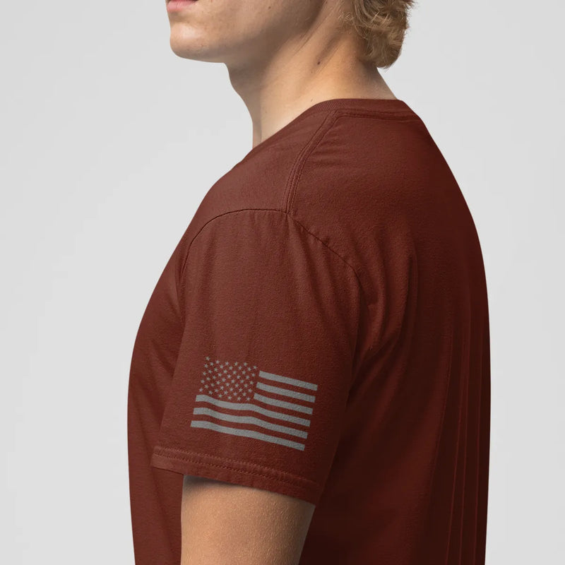 Left side view of a firefighter T-shirt in cardinal red color with the USA flag printed.