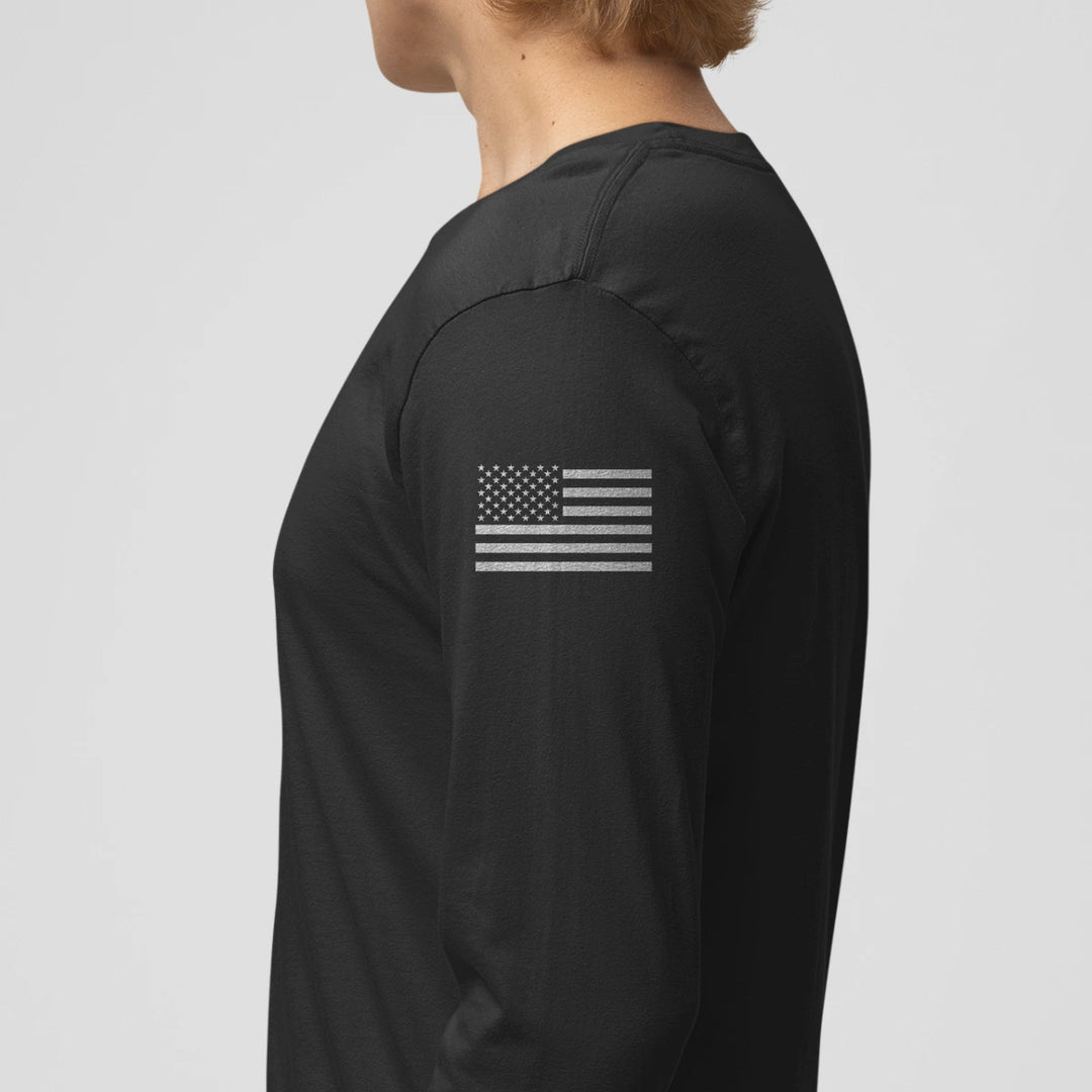 Left side view of a firefighter long sleeves in black color with the USA flag printed.