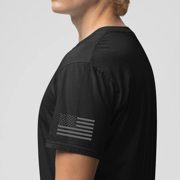 Left side view of a firefighter T-shirt in black color with the USA flag printed.