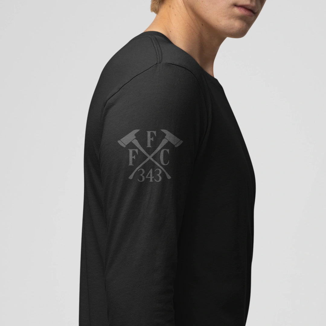 Right side view of a firefighter long sleeves in black color with the  FFC 343 logo.