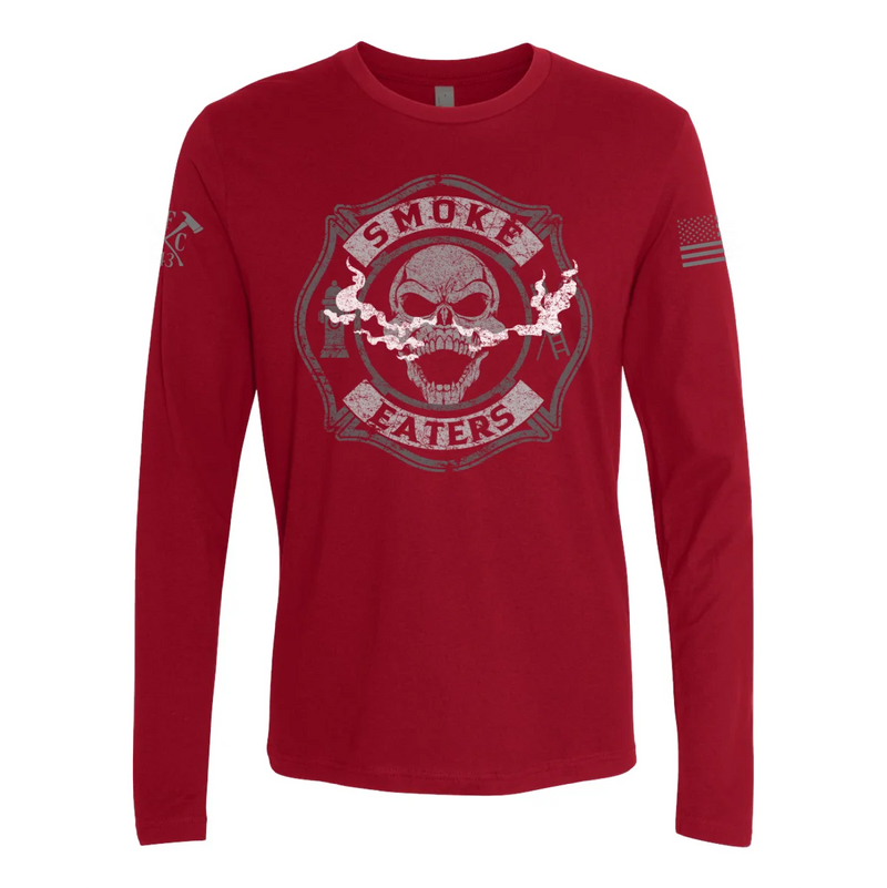 Front view of firefighter long sleeves in cardinal red color featuring a full-front design print of a skull inhaling smoke, with a distressed grey and off-white look. 