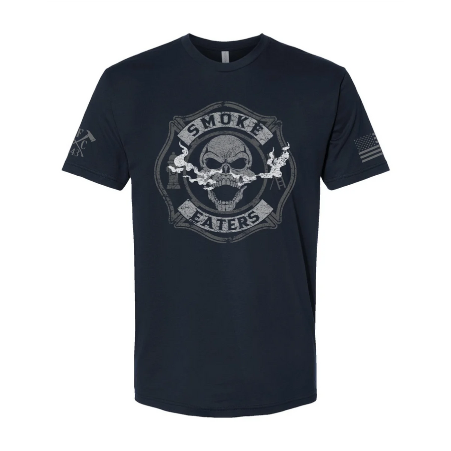 Front view of firefighter T-Shirt in navy color featuring a full-front design print of a skull inhaling smoke, with a distressed grey and off-white look. 