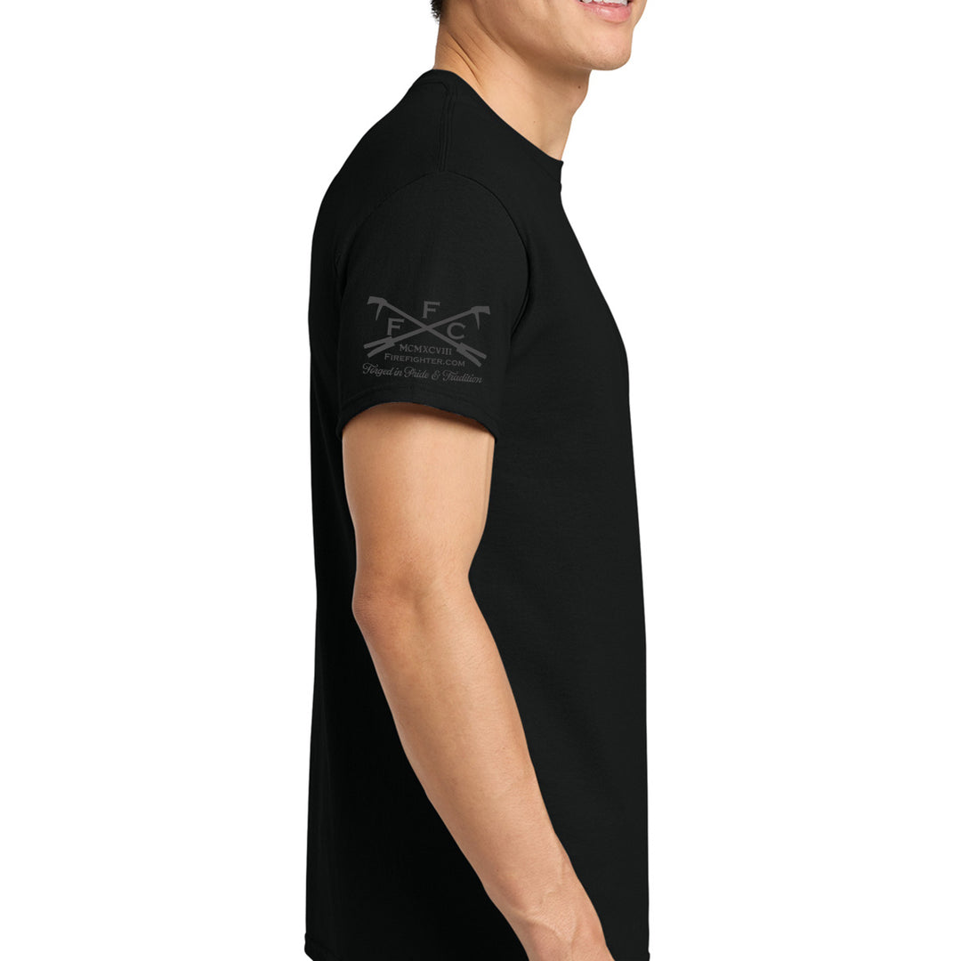 A man wearing a black short-sleeve t-shirt, shown from a side profile against a plain white background. The t-shirt features a dark gray FFC logo on the left sleeve  #color_black