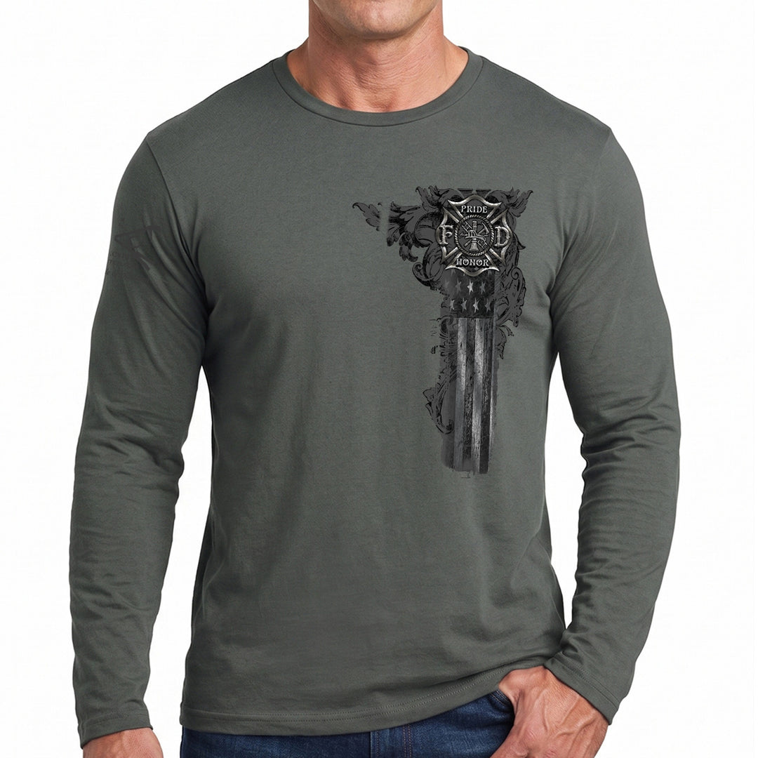 A man wearing a dark gray long-sleeve t-shirt with a distressed black and gray graphic of a firefighter's helmet and American flag on the chest, paired with blue jeans against a plain white background. #color_charcoal