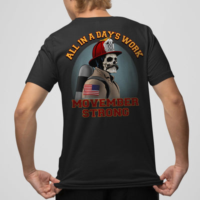 Firefighter t-shirt with skull design and text 'All In A Day's Work' and 'Movember Strong