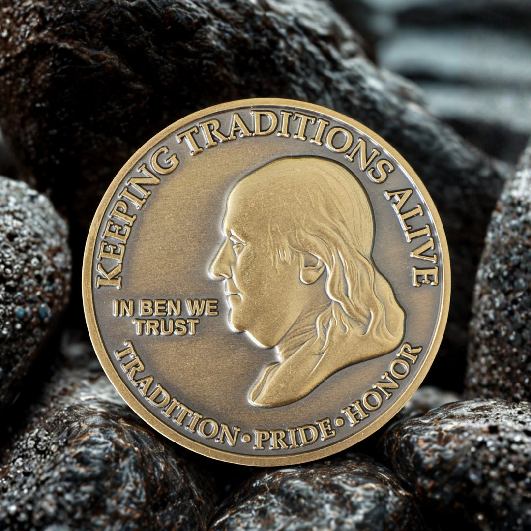 Firefighter.com exclusive 'In Ben We Trust' challenge coin featuring Benjamin Franklin and 'Keeping Tradition' motto. Antique bronze finish.