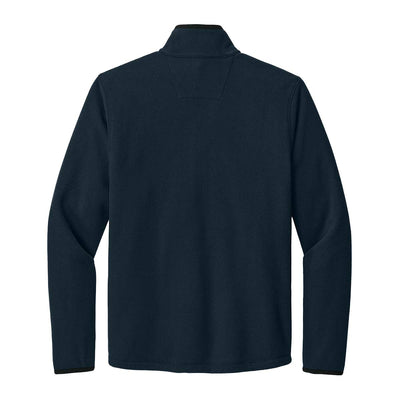 Fleece jacket featuring two front zippered pockets for secure storage, with the Carhartt label sewn on the left pocket.