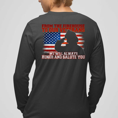 Silhouette of a firefighter saluting against a distressed American flag on long sleeve t-shirt.