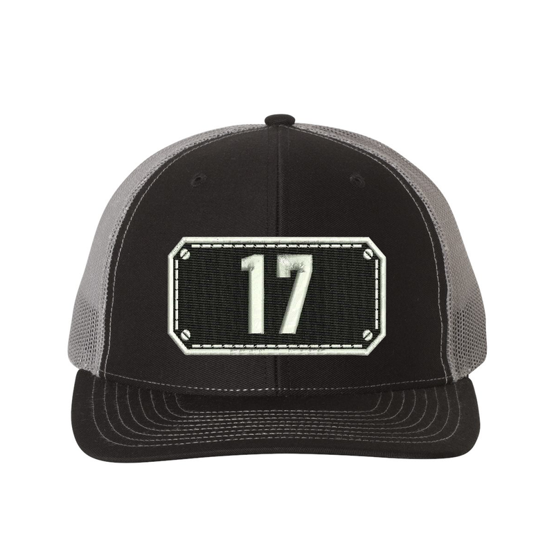 Richardson Trucker Hat.  Black Shield design with your fire station number embroidered in the shield.  Hat color black/charcoal.
