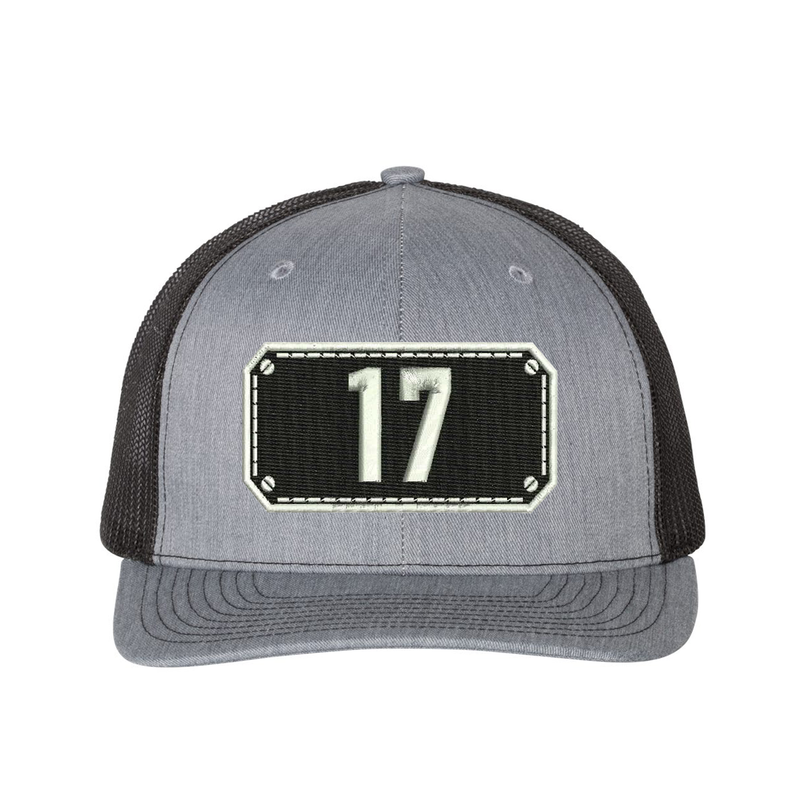 Richardson Trucker Hat.  Black Shield design with your fire station number embroidered in the shield.  Hat color heather grey/black.